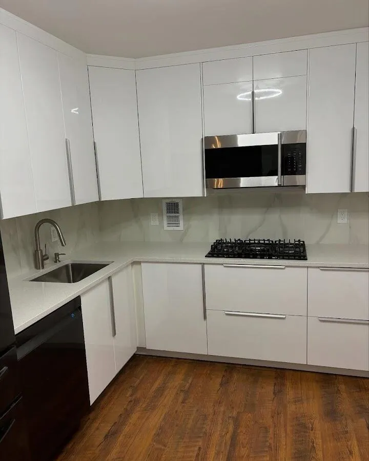Restored kitchen with white cabinets after water damage in National City